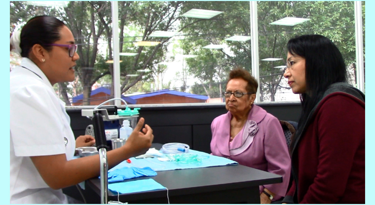 Older adult and family with a nurse.