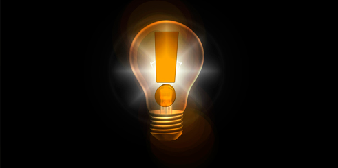 Foco encendido con signo de admiración.