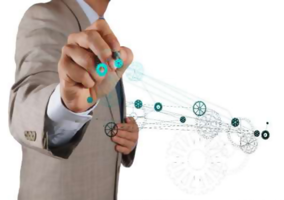 Se mira de perfil el torno de un hombre trajeado con el puño hacia el frente, de donde salen algunos gráficos que evocan creación.